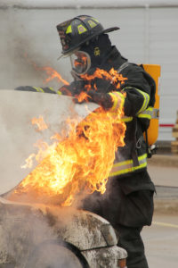 Firefighter checks under hood