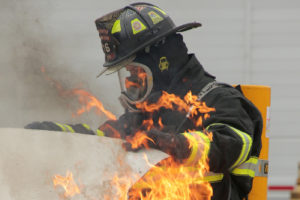 Firefighter checks under hood