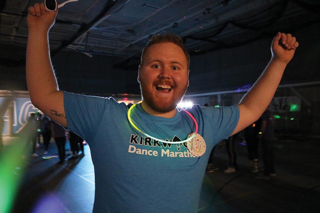 Kirkwood Dance Marathon Co-Chair Tyler Carlson, business management, celebrates during the final hour of KDM at the Rec Center on Feb. 21.