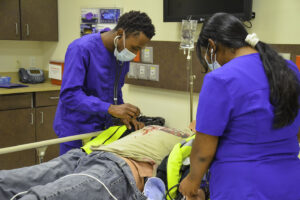 Nursing students practice taking blood pressure