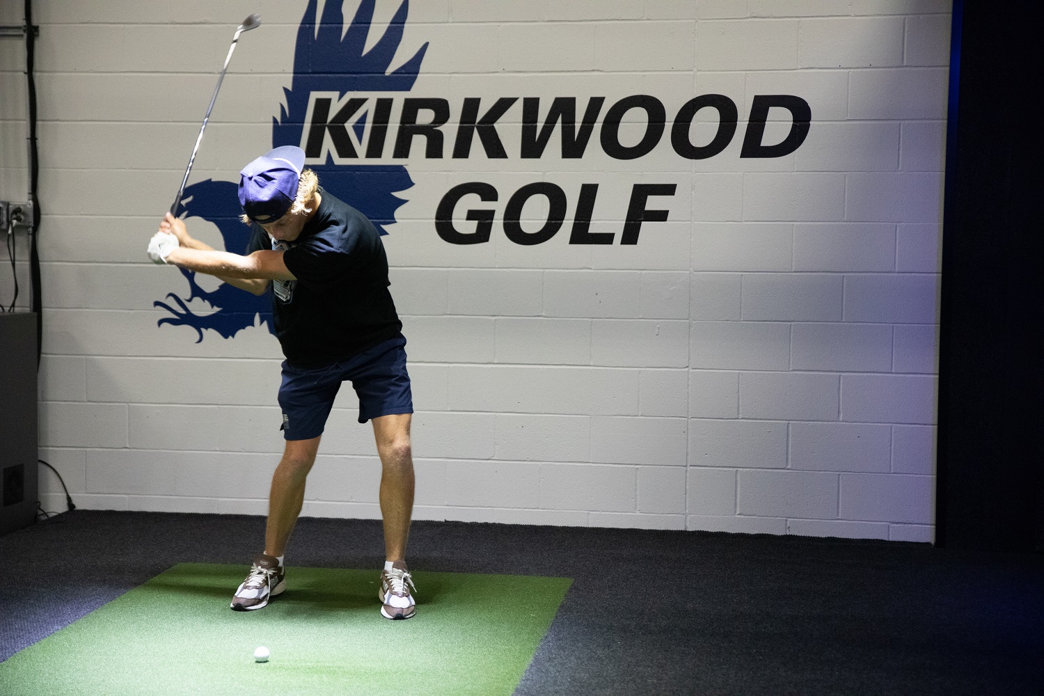 Gannon Hall, business major and a player for the Kirkwood Community College golf team, practices on Thursday, Sept. 28. Golfers use the Golf Simulator located in the upper section of Johnson Hall.