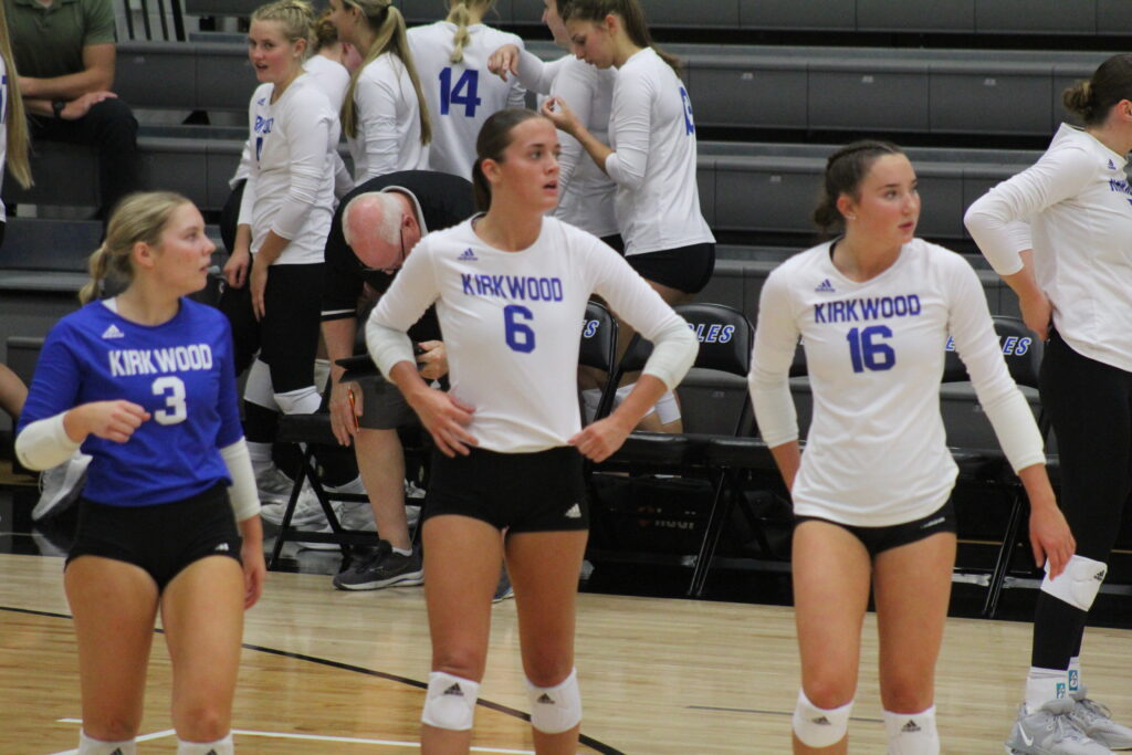 Lilly Van Severen, Lexi Hearn, and Addy Grimm walk on the court after a timeout in the first set on Sept. 21 in Johnson Hall.