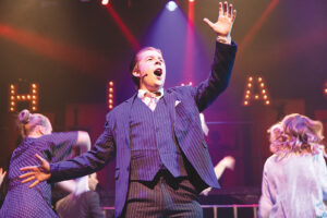 Jacob Cacioppo, who plays Amos Hart, performs “We Both Reached For the Gun.”