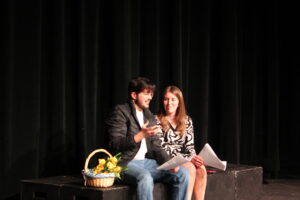 two students performing a play