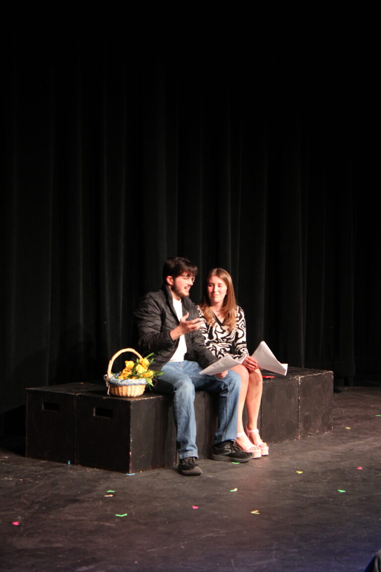 two students performing a play