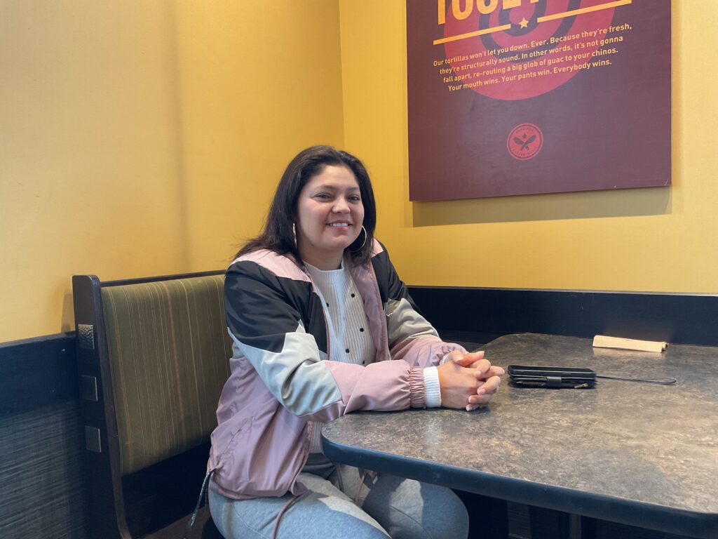 Keyvi Reconco, who takes online ESL classes at Kirkwood Community College, meets for an interview at a local Pancheros.