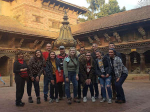 Photo of students posing while visiting a temple during the Nepal study abroad.